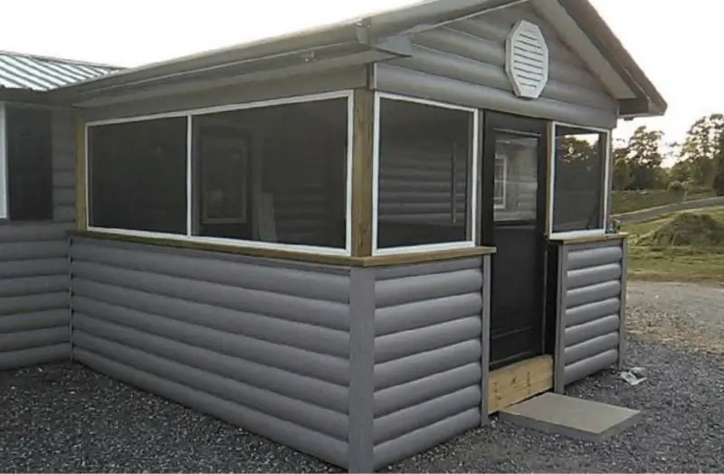 Screened room build with log-style siding